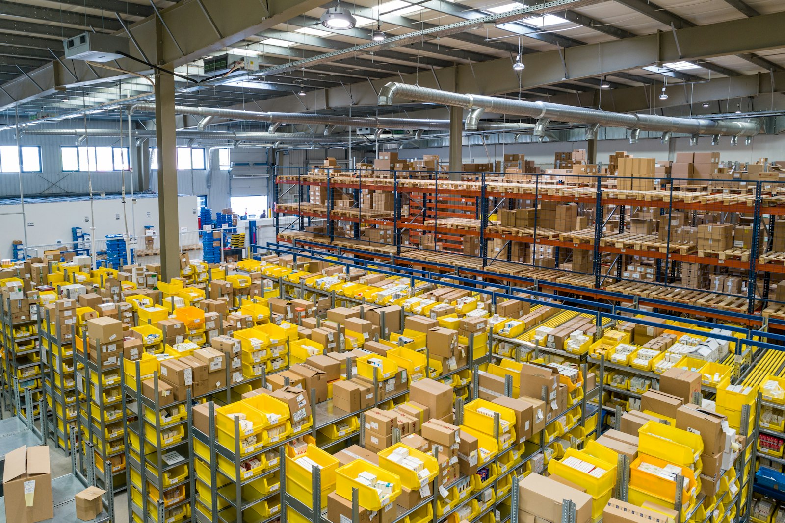 Warehouse floor with racking and dispatch activity — placeholder, replace with a client site photograph
